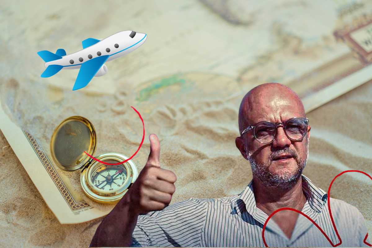 Enrico Camelio ed una bussola nella sabbia